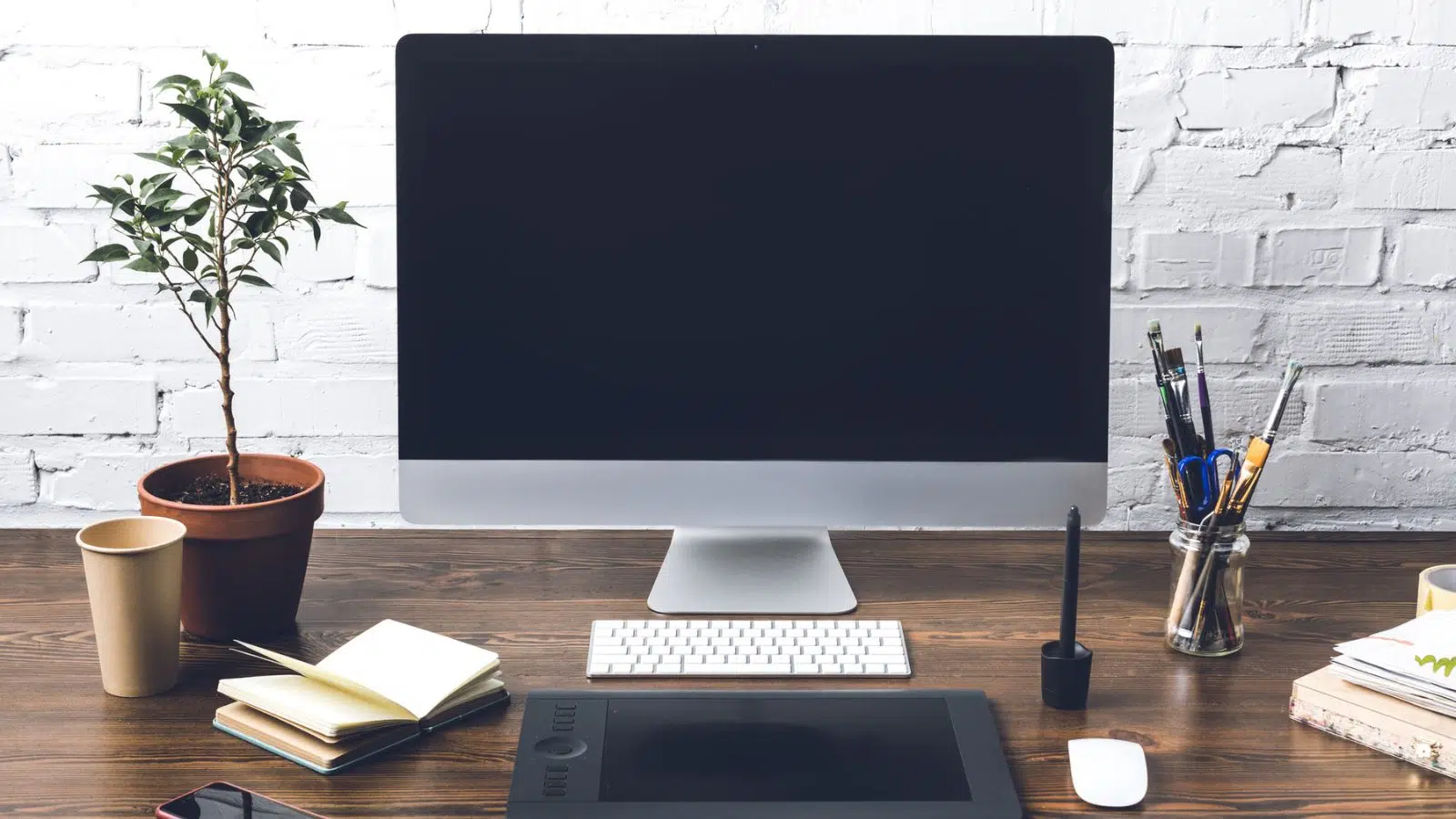 keyboard with computer and plant