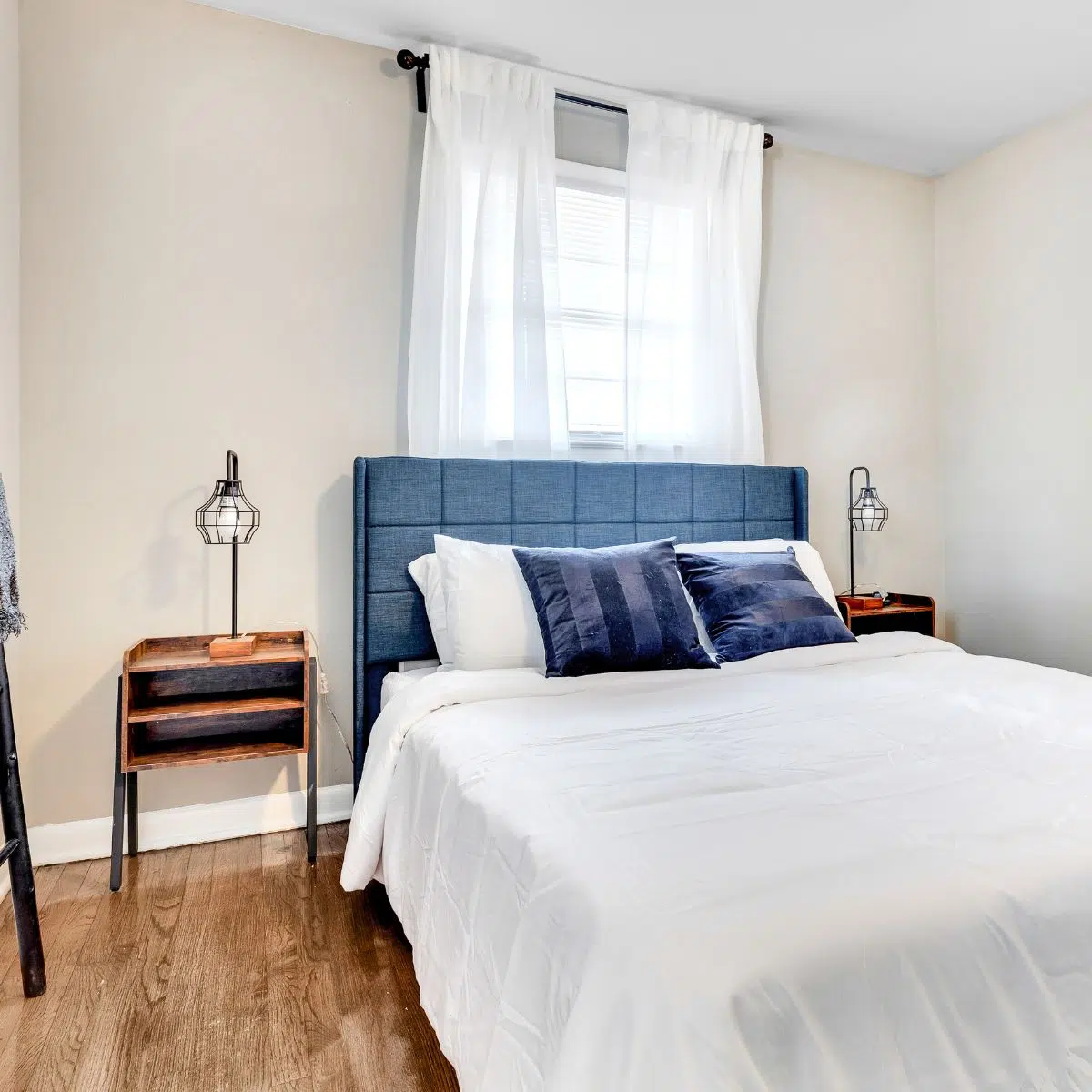 Image of bedroom with blue headboard