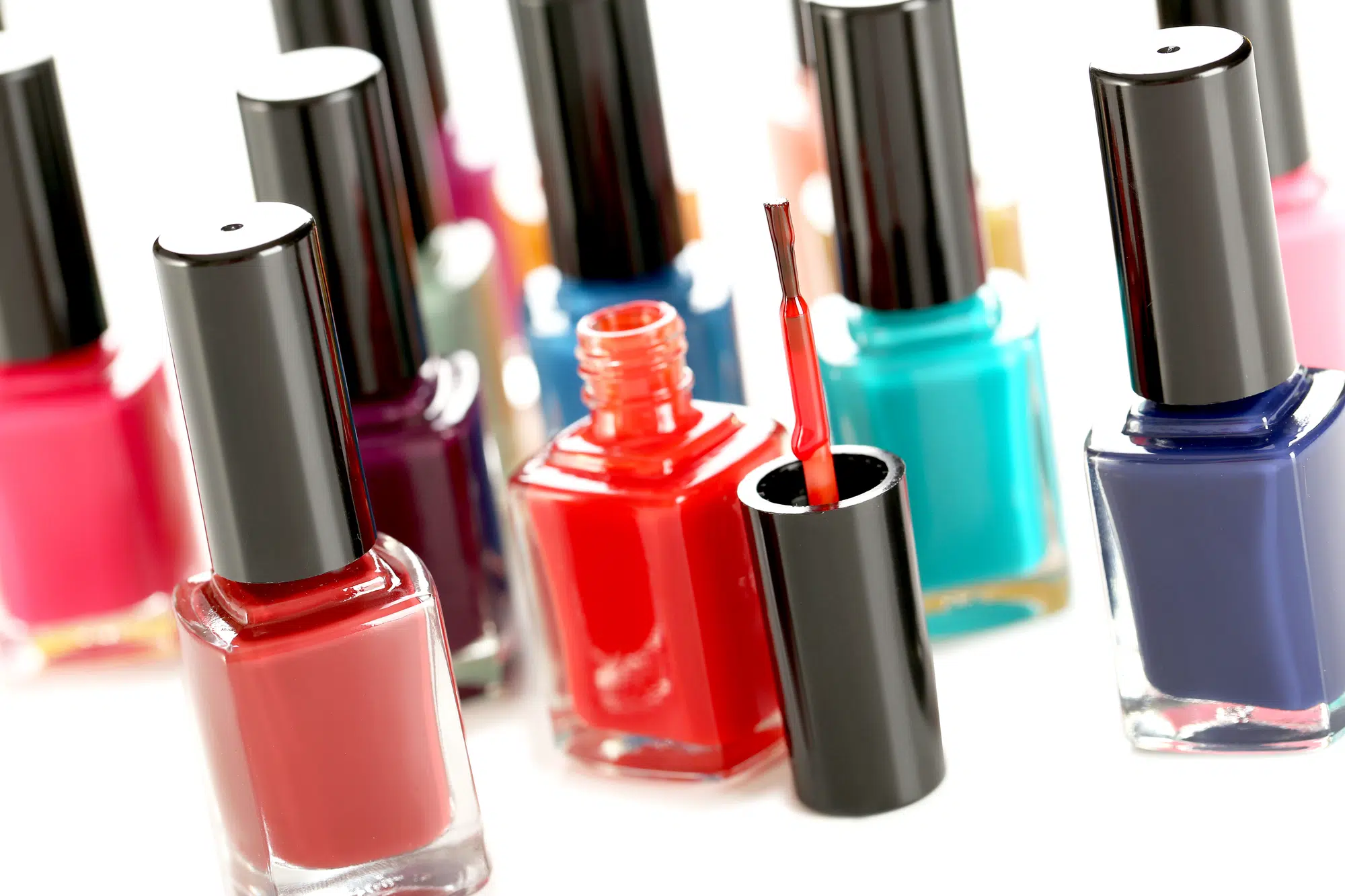 Bottles of nail polish on a white background