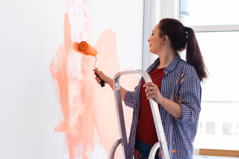woman painting a wall