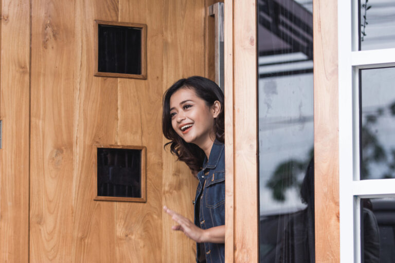 woman opening up front door