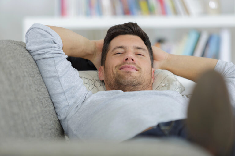 man lying on couch