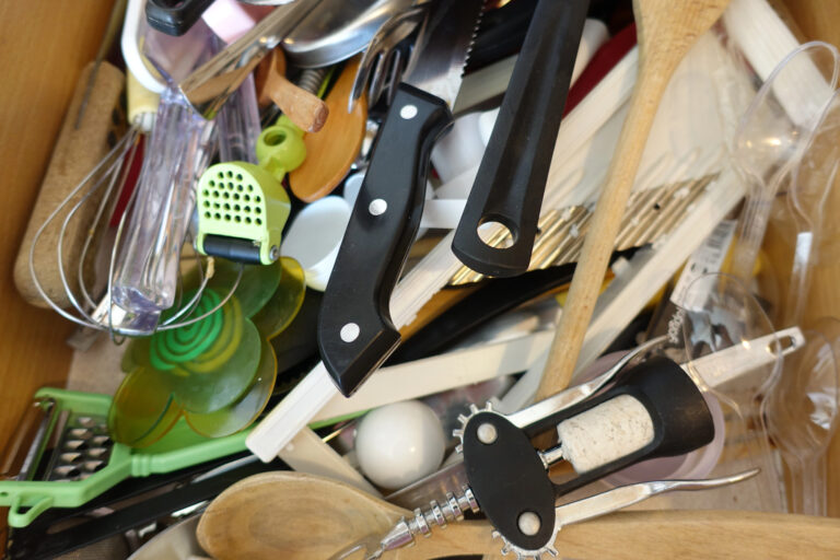 messy junk drawer in kitchen