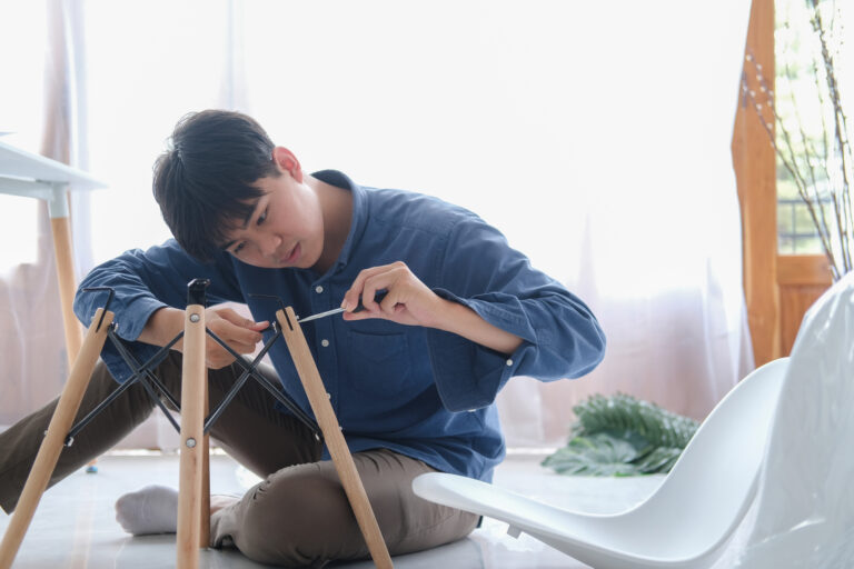 man fixing a chair
