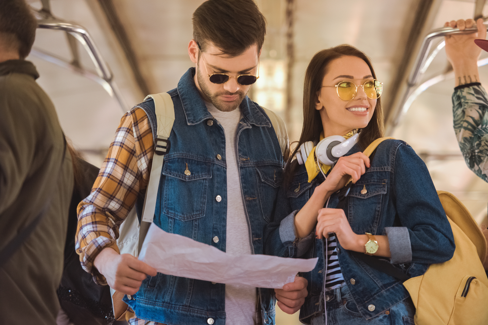 couple on train with map