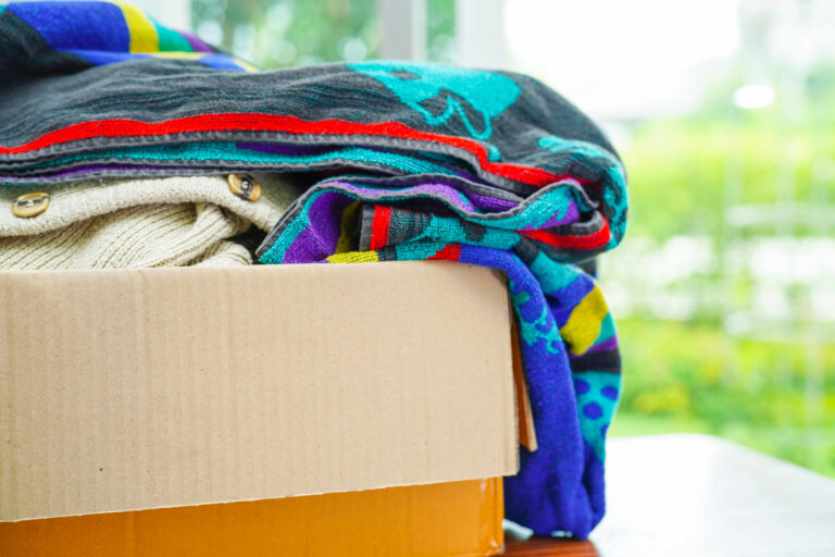 clothes in a donation box for thrift store