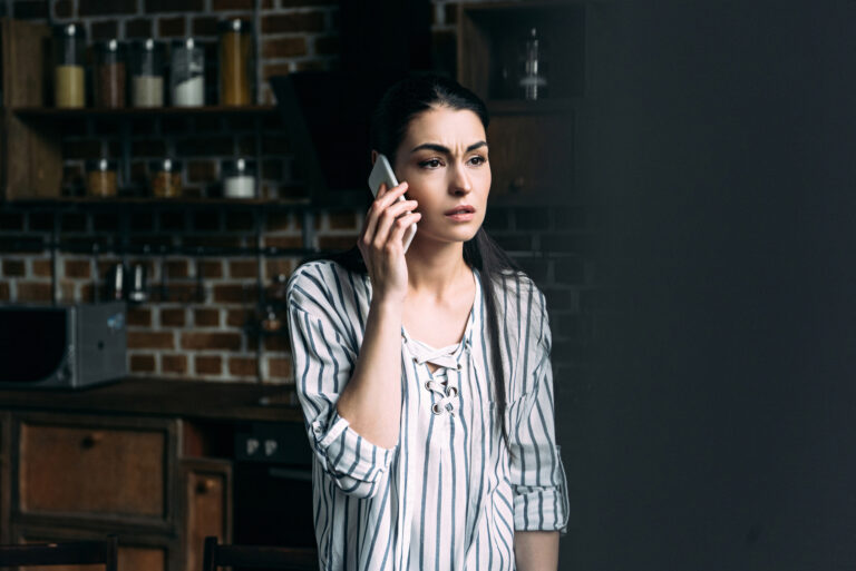 upset woman on phone