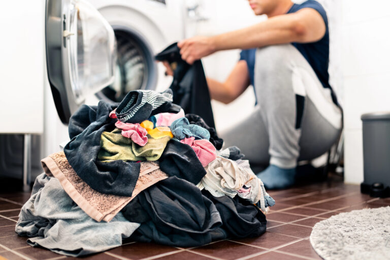 man doing laundry