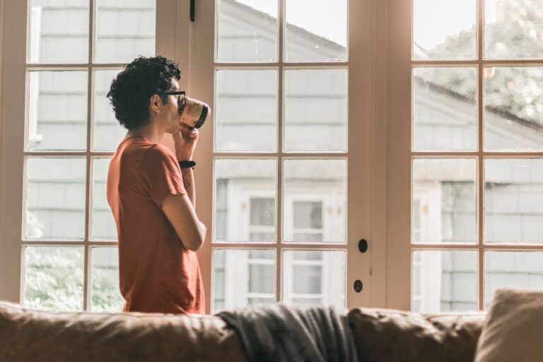 guy looking outside window